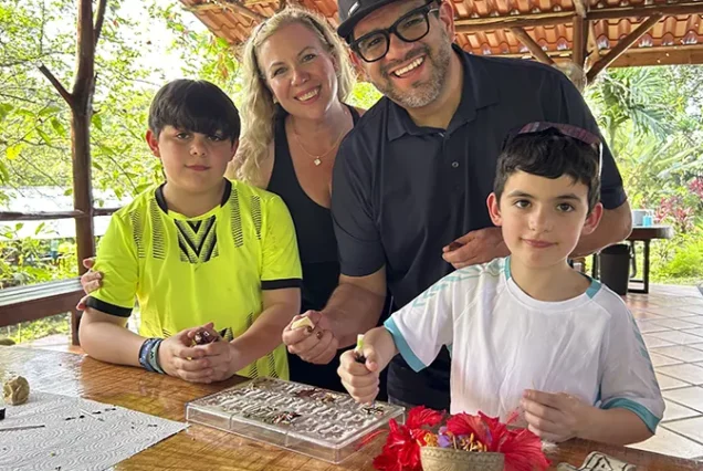 Family enjoying a chocolate-making workshop in Costa Rica