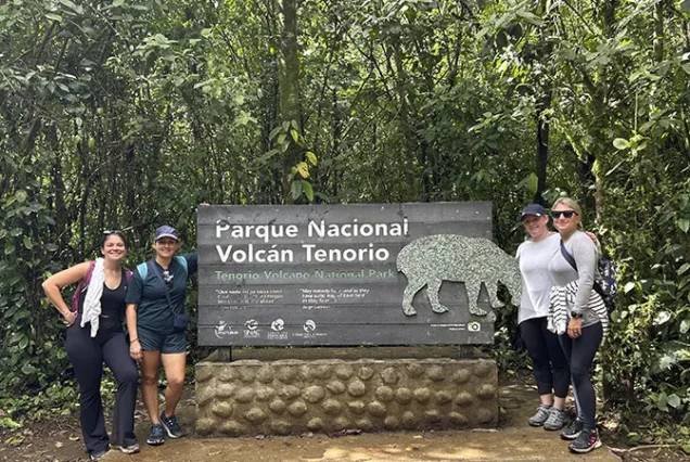 Travelers exploring Tenorio Volcano National Park near Río Celeste, Costa Rica
