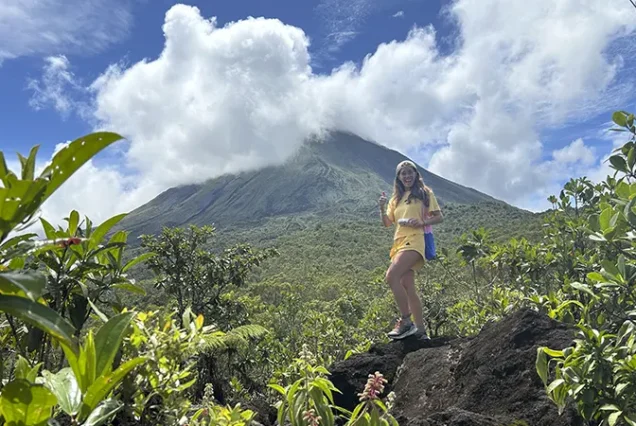 Hiking near Arenal Volcano surrounded by lush rainforest in La Fortuna, Costa Rica
