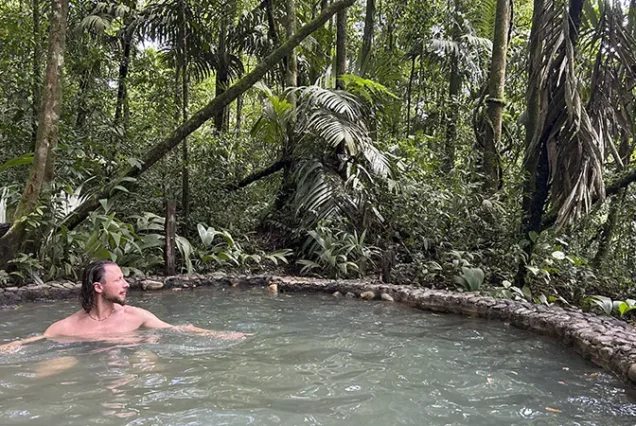 Natural hot springs surrounded by rainforest in La Fortuna, Costa Rica